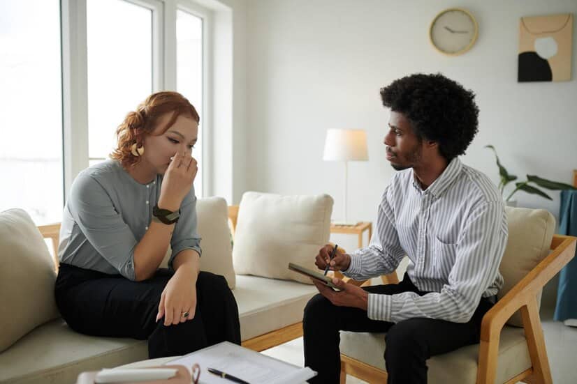 1768249230_sad-crying-young-woman-talking-therapist-about-her-traumatic-experience_274689-46447 1768249230 sad crying young woman talking therapist about her traumatic experience 274689 46447 1