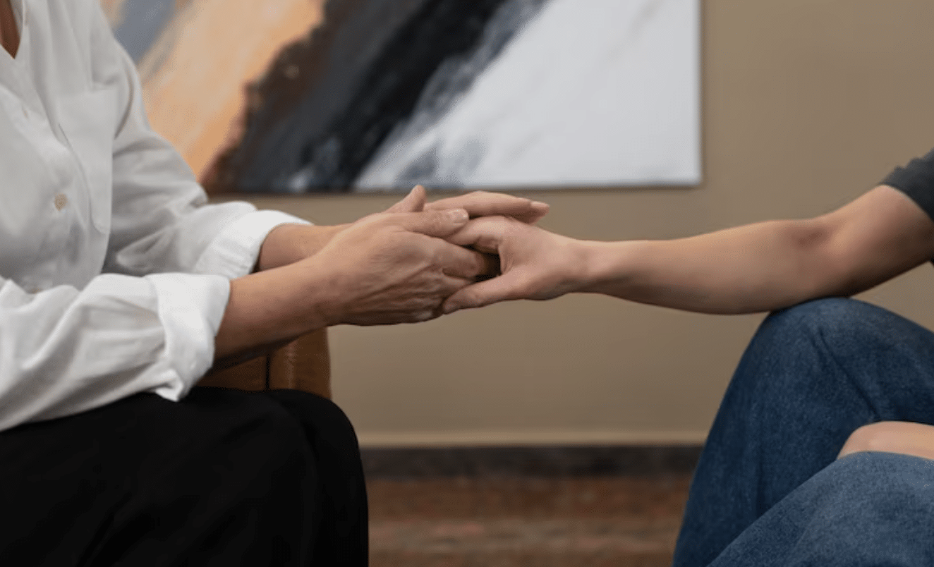 psychiatrist-compassionately-holding-patient’s-hand-during-difficult-moment