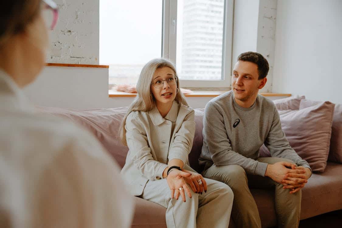 Couple discussing their mental health with a psychiatrist.